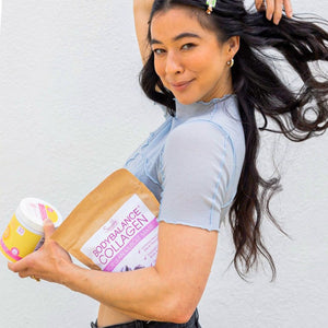 Dancer Meagan Kong holding Sparkle Wellness collagen peptide products